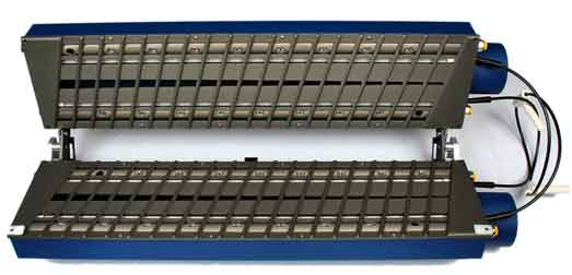 Open clamshell-style web cleaner with blue end caps and slotted metal plates